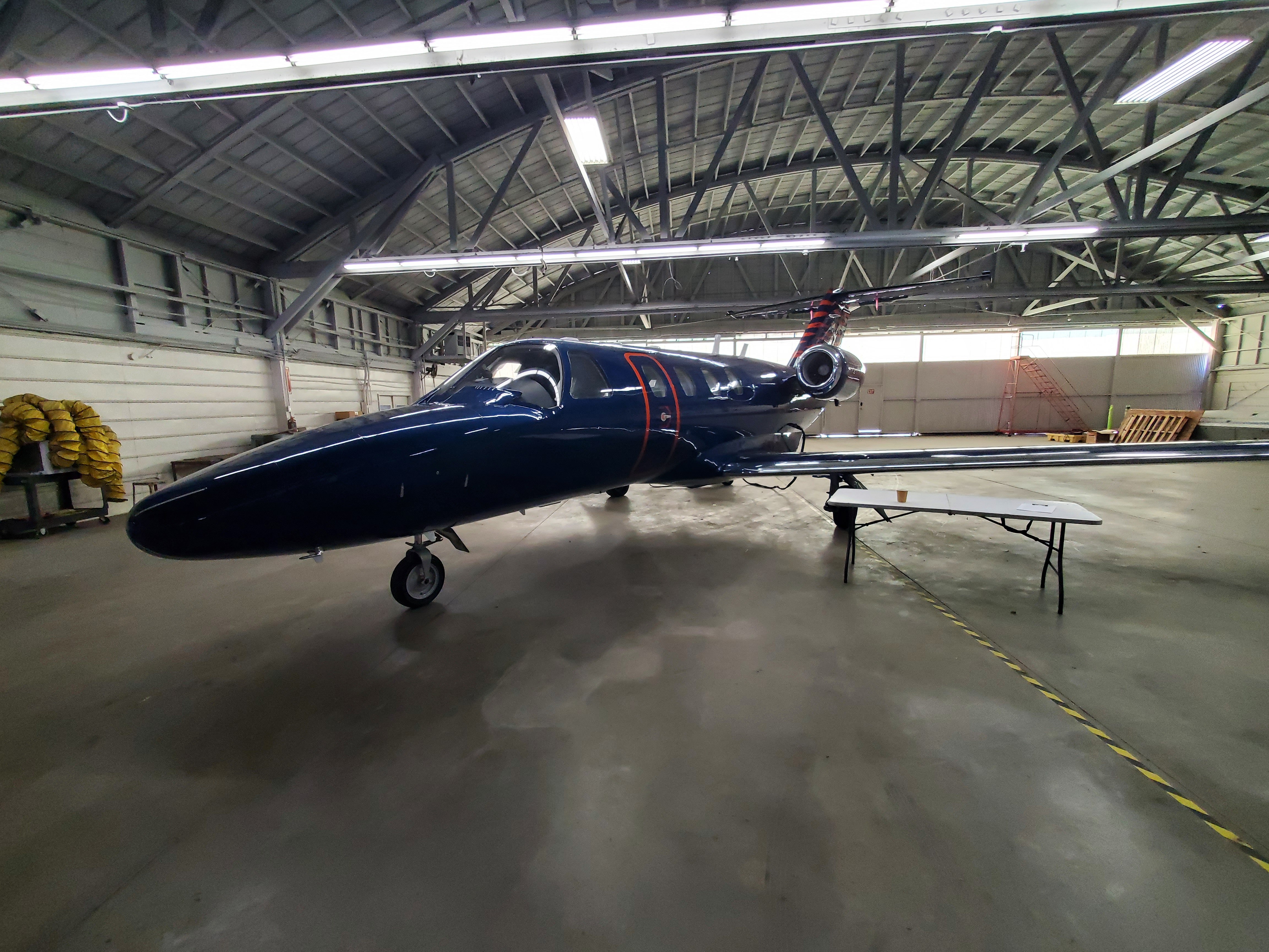 Business jet aircraft in hangar - Professional aviation services